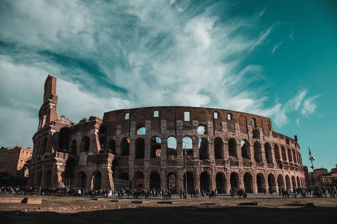 The Colosseum in Rome under a dramatic sky